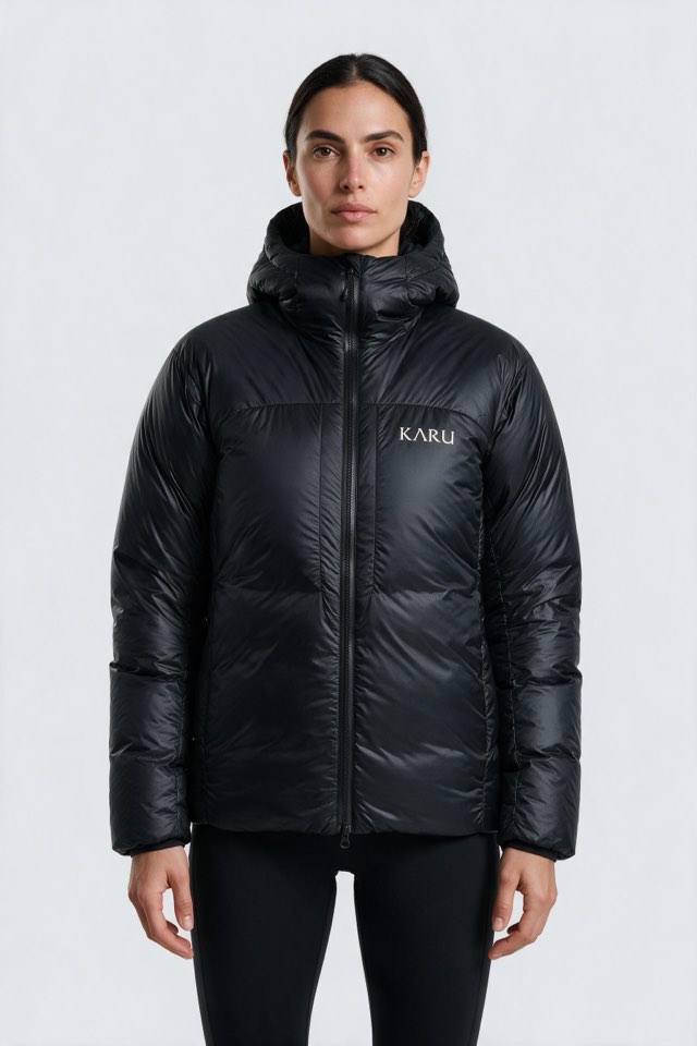 Nallo Down in night black, worn by a model, studio product shot on a seamless neutral ground