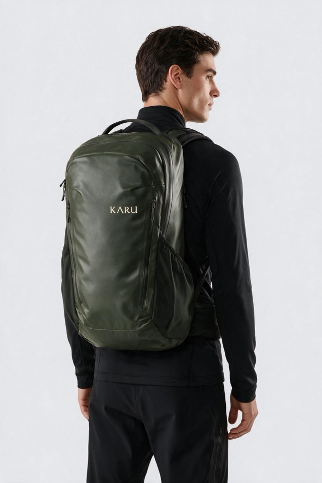 Teusa 45 pack in deep moss, worn on the back, studio product shot on a seamless neutral ground