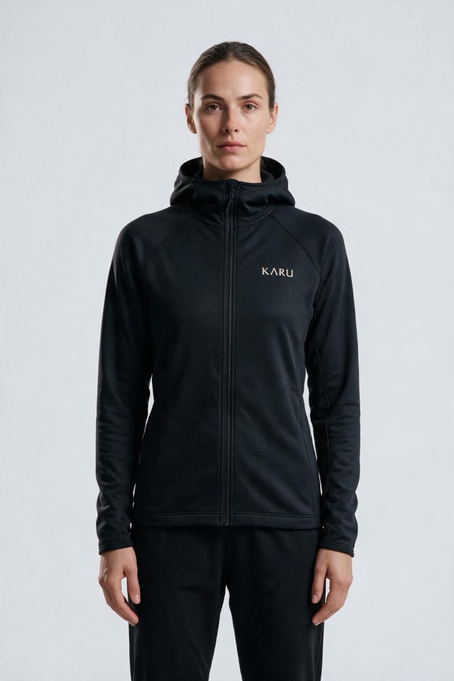 Torne Hoodie in night black, worn by a model, studio product shot on a seamless neutral ground