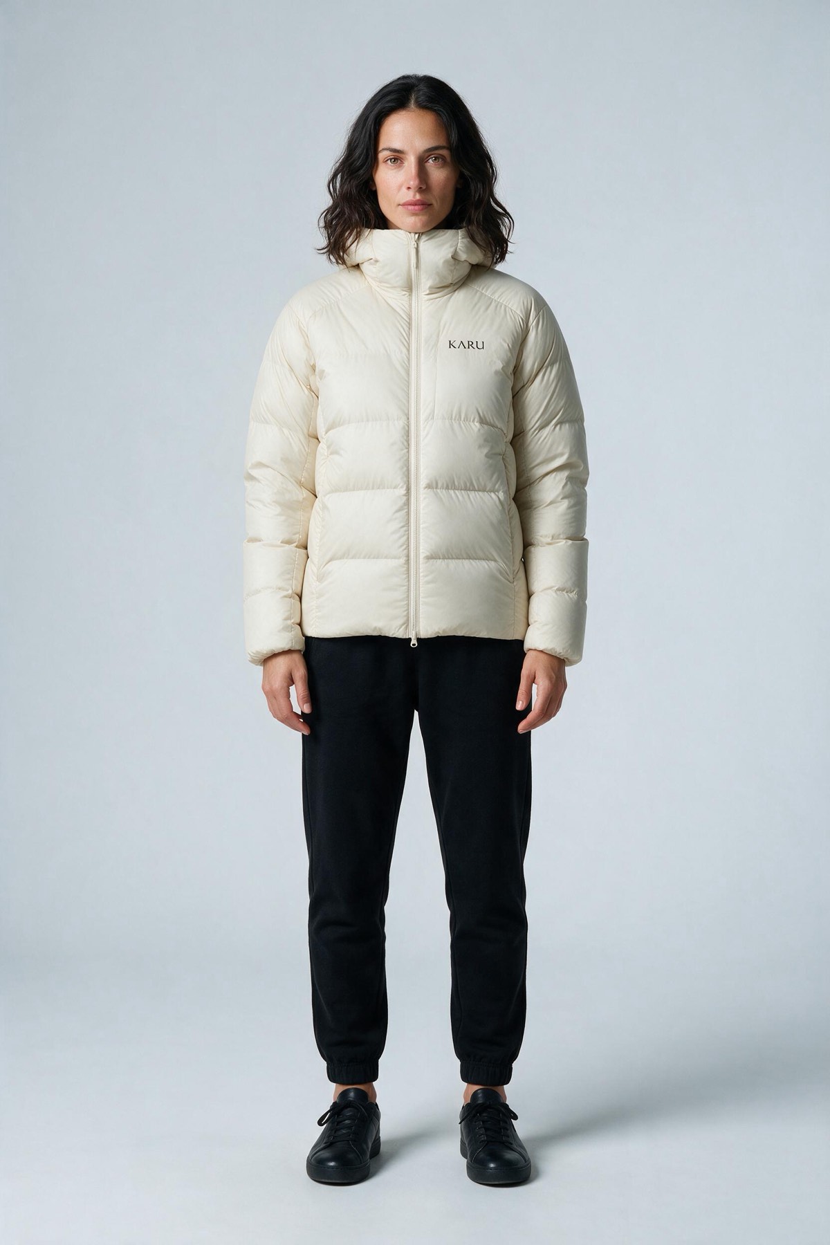 Nallo Down Ecru in ecru off-white, worn by a model, studio product shot on a seamless neutral ground