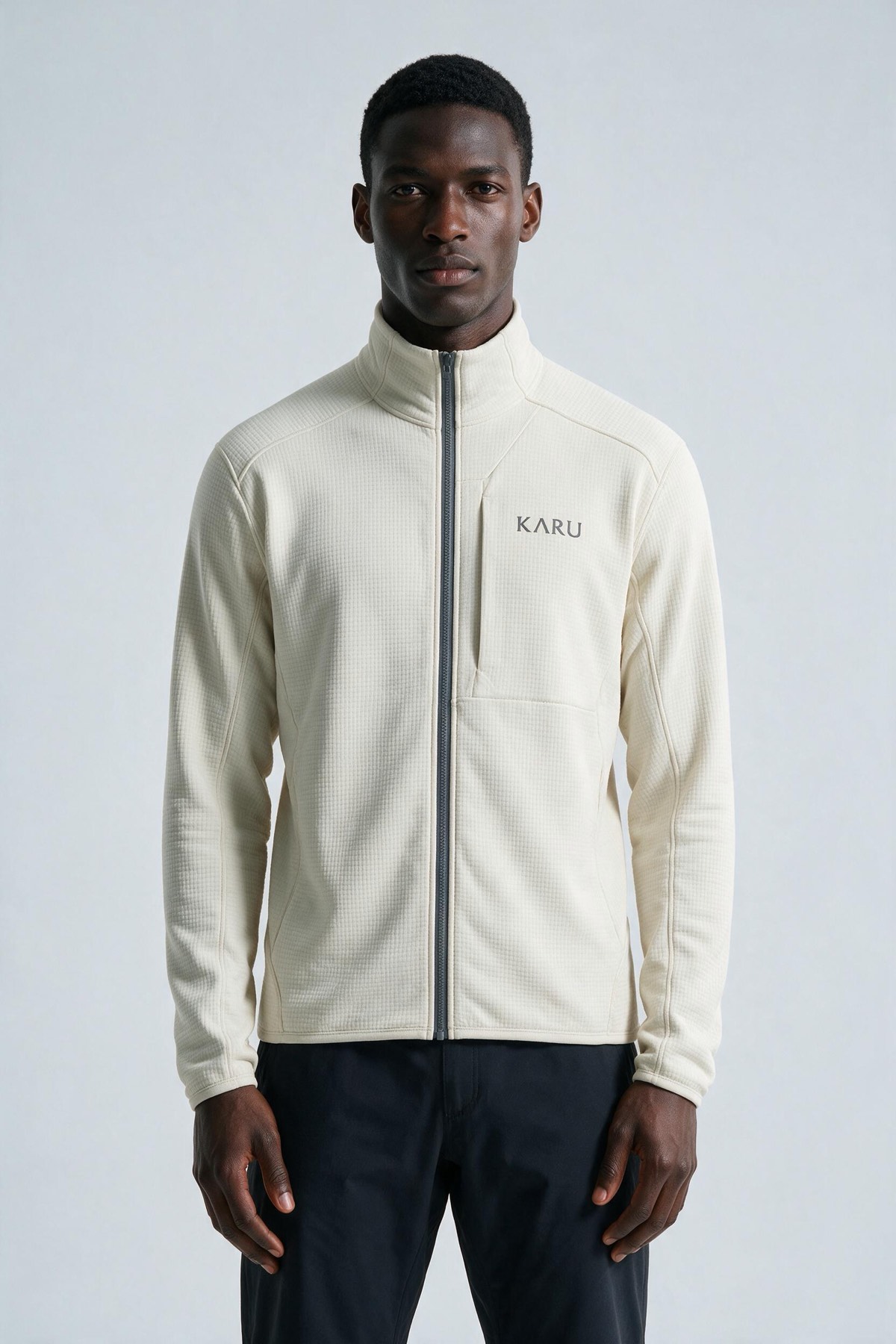 Salto Fleece Ecru in ecru off-white, worn by a model, studio product shot on a seamless neutral ground