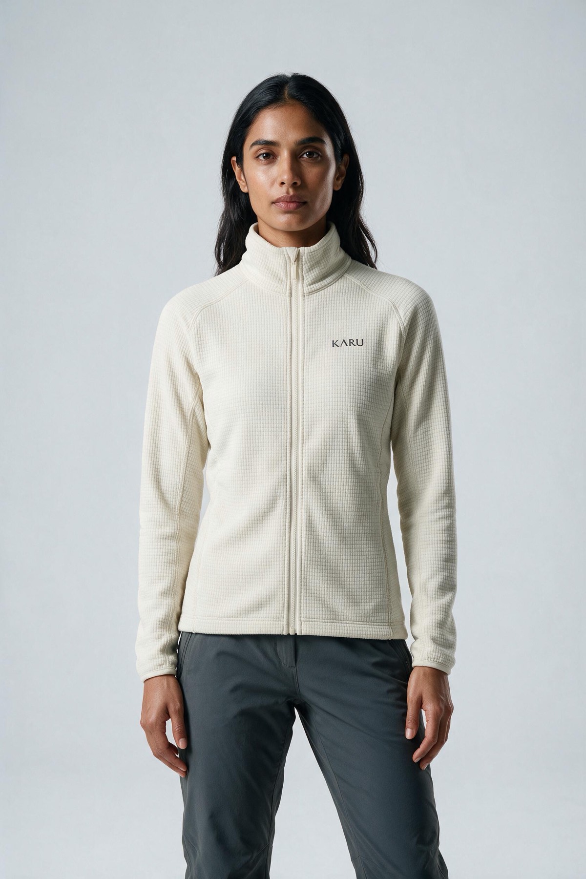 Salto Fleece Ecru in ecru off-white, worn by a model, studio product shot on a seamless neutral ground
