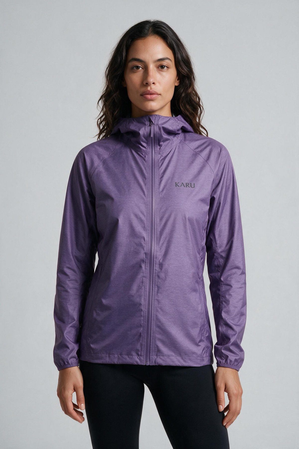 Singi Shell Purple in muted heather purple, worn by a model, studio product shot on a seamless neutral ground